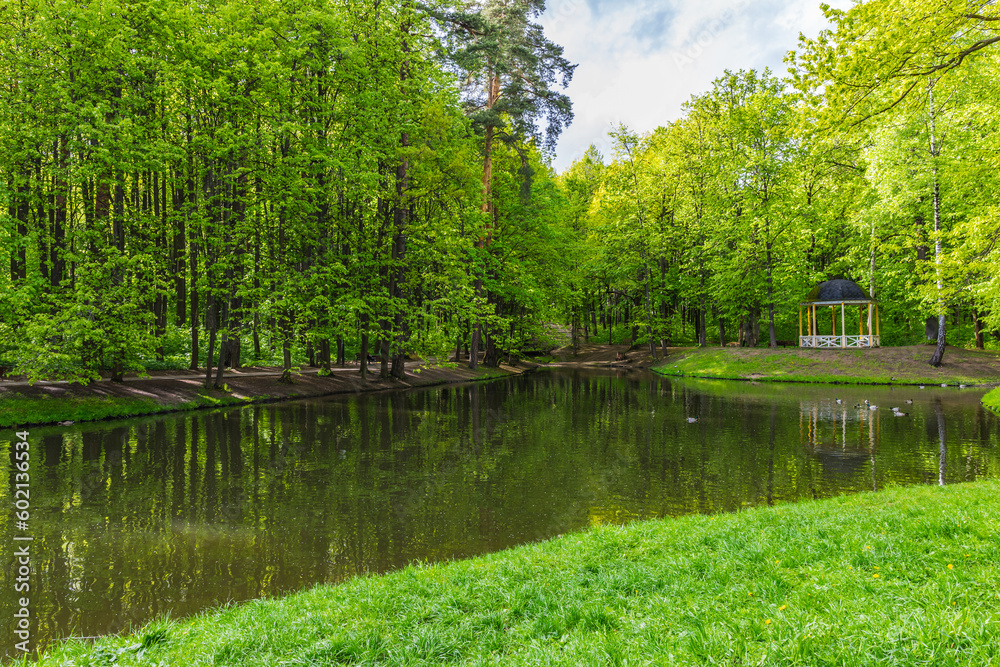 Ivanovskie Ponds - a large city park with beautiful linden alleys and a large pond in Krasnogorsk, Moscow region, Russia. Ivanovskie Ponds - a large city park with beautiful linden alleys and a large pond in Krasnogorsk, Moscow region, Russia.