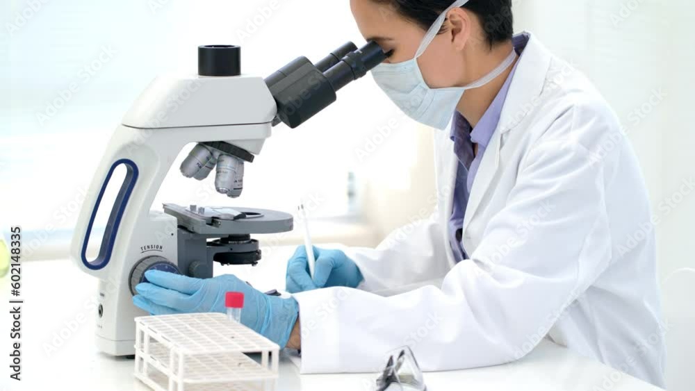 Doctor, covid or woman scientist with microscope in science lab writing DNA research, medical or medicine data analysis. Study, learning or nurse for healthcare innovation, cancer or futuristic test Doctor, covid or woman scientist with microscope in science lab writing DNA research, medical or medicine data analysis. Study, learning or nurse for healthcare innovation, cancer or futuristic test