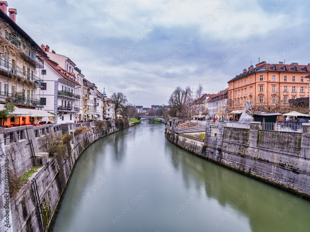 Ljubljana river and riverside historic buildings on a cloudy afternoon, Slovenia