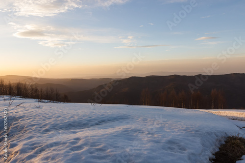 Sunset with a view of the snow-capped mountain peaks of Arkhyz near the BTA © lindely