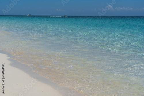 Tropical beach with white sand and blue water in Paradise Island  Bahamas