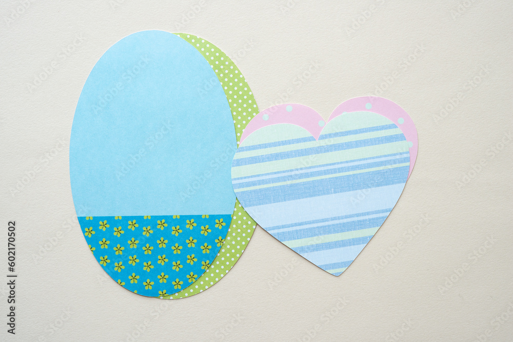 machine-cut hearts and ovals on blank beige paper