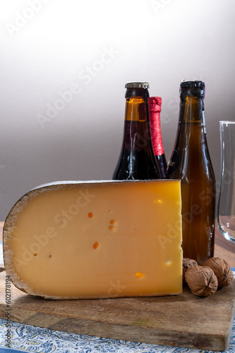 Cheese and beer pairing, Belgian beer and old yellow cow milk cheese from Bruges photo