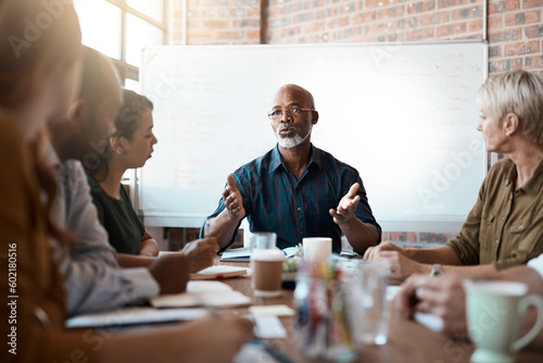 Business people, meeting and leadership of black man in office, talking or speaking. Teamwork, ceo and senior African male professional brainstorming, collaboration or planning strategy in startup. photo