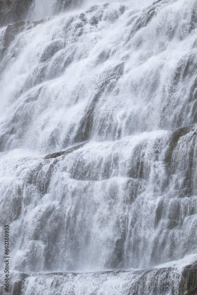 Waterfall Water Texture. Pure water background. Beautiful Nature in Iceland. Powerful Mountain River. Huge Water Stream, Infinite Natural Energy. Travel Europe. Dynjandi. Waterfall Water Texture. Pure water background. Beautiful Nature in Iceland. Powerful Mountain River. Huge Water Stream, Infinite Natural Energy. Travel Europe. Dynjandi.