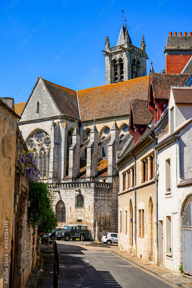 Old street leading to Our Lady of the Nativity Church in the former medieval walled city of Moret-sur-Loing in Seine et Marne, France