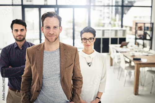 Portrait, teamwork and management with a business man and his team standing in the office together. Leadership, manager and collaboration with a group of businesspeople looking confident about work