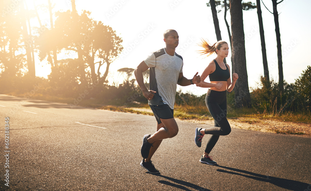 © Donson/peopleimages.com - Fitness, running and freedom with couple in road for workout, cardio performance and summer. Marathon, exercise and teamwork with black man and woman runner in nature for sports, training and race © Donson/peopleimages.com - Fitness, running and freedom with couple in road for workout, cardio performance and summer. Marathon, exercise and teamwork with black man and woman runner in nature for sports, training and race