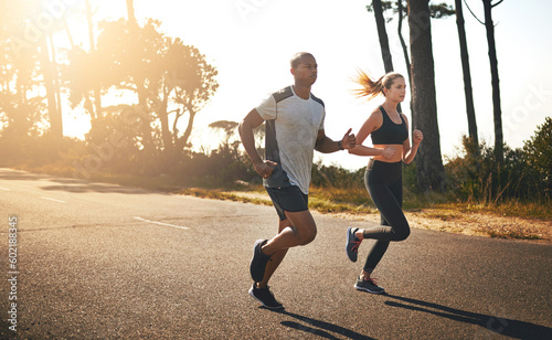 Fitness, running and freedom with couple in road for workout, cardio performance and summer. Marathon, exercise and teamwork with black man and woman runner in nature for sports, training and race