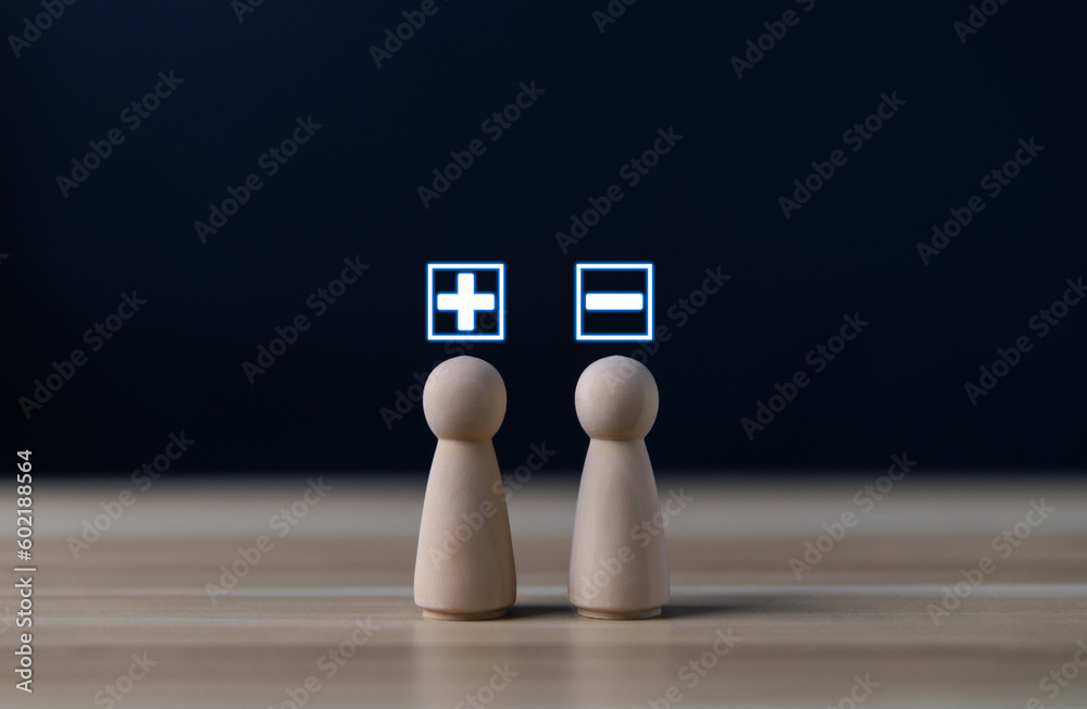 Foto de Block people show plus and minus symbols. The concept of ...
