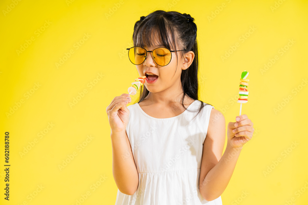 happy smiling asian baby girl on yellow background happy smiling asian baby girl on yellow background