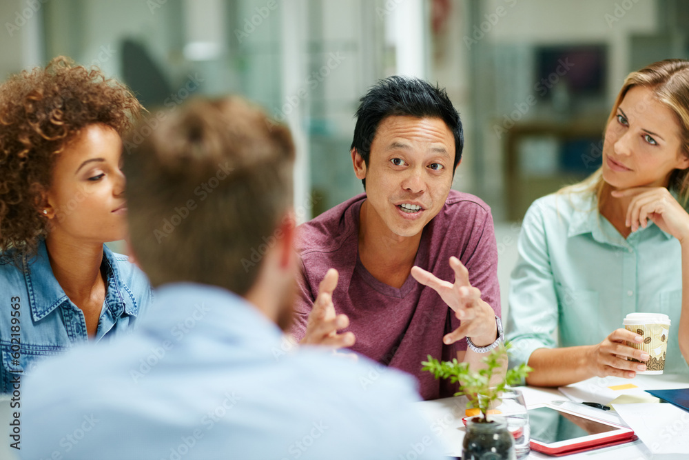 Obraz premium Talking, business and employees planning, teamwork and partnership for development, growth and new project. Male person, manager or leader with staff, brainstorming and collaboration in the workplace