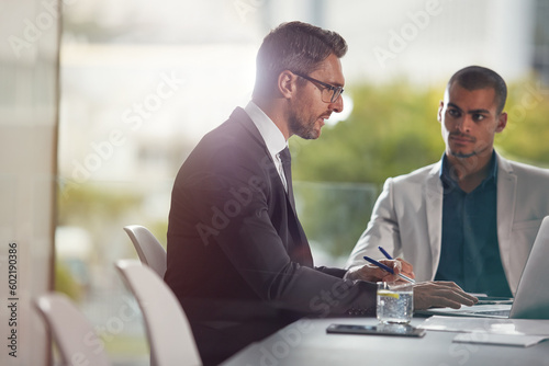Planning, laptop and business men with manager for discussion, collaboration and corporate management in office. Professional people, boss or clients speaking, review and advice, meeting and computer