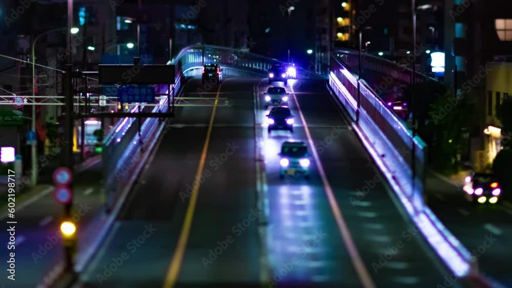 A night timelapse of the miniature traffic jam at the city street zoom A night timelapse of the miniature traffic jam at the city street zoom