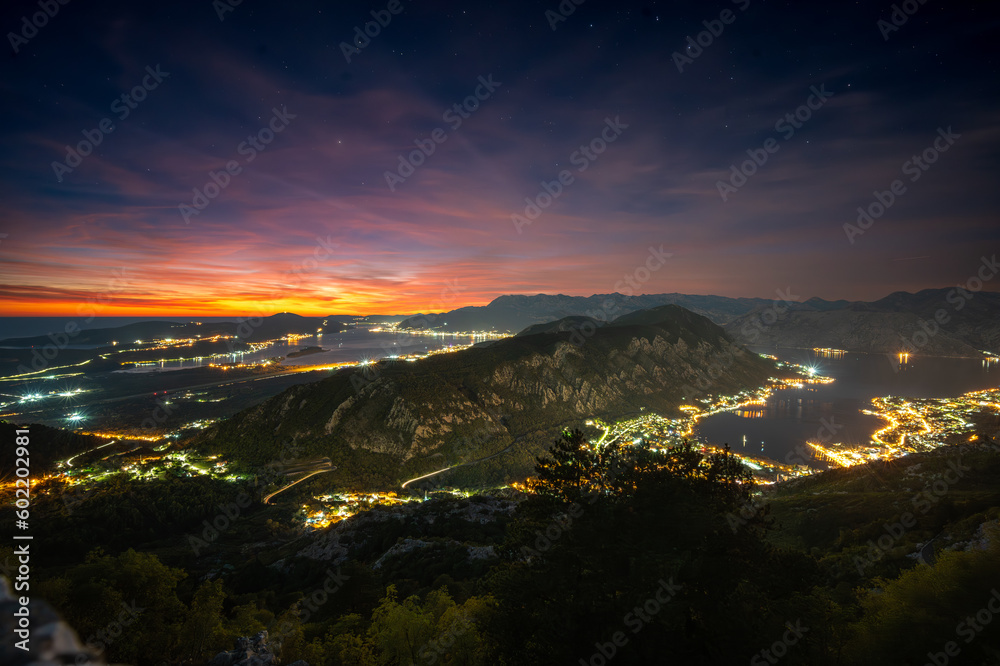 Bay of Kotor lights taken from mountain at late sunset with orange and purple sky Bay of Kotor lights taken from mountain at late sunset with orange and purple sky