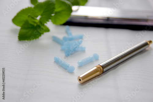 Concept image of Lancets  a needle that can draw blood without pain  and a gun medical device in the shape of a sharpie