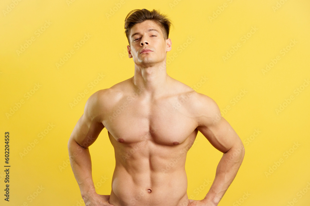 Fototapeta premium Strong and sensual nude man looking at camera