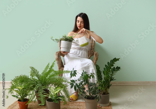 Young woman with watering c...