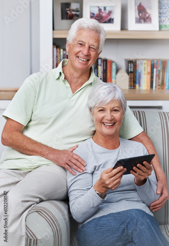 Portrait, senior couple and smile with tablet, sofa and home for social media, online news app and ebook. Happy old man, woman and digital technology for subscription, website and internet connection