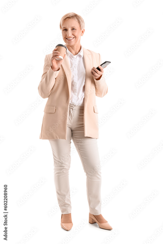 Mature businesswoman with coffee and mobile phone on white background Mature businesswoman with coffee and mobile phone on white background