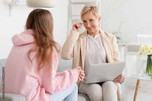 Mature psychologist working...