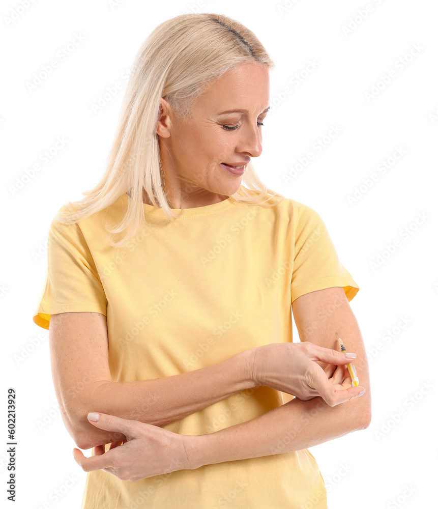 Mature diabetic woman giving herself insulin injection on white background Mature diabetic woman giving herself insulin injection on white background