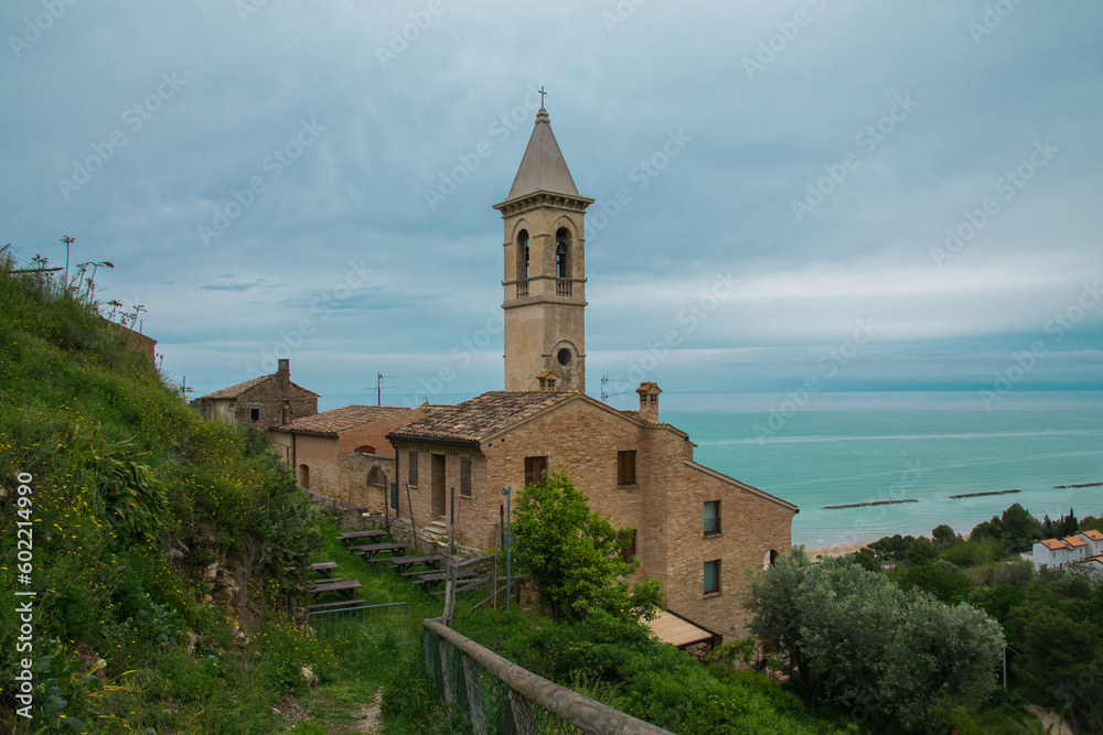 View of old roman church of Santa Maria del Suffragio in the medieval center of Cupra Marittima over the adriatic sea, Marche region, Italy