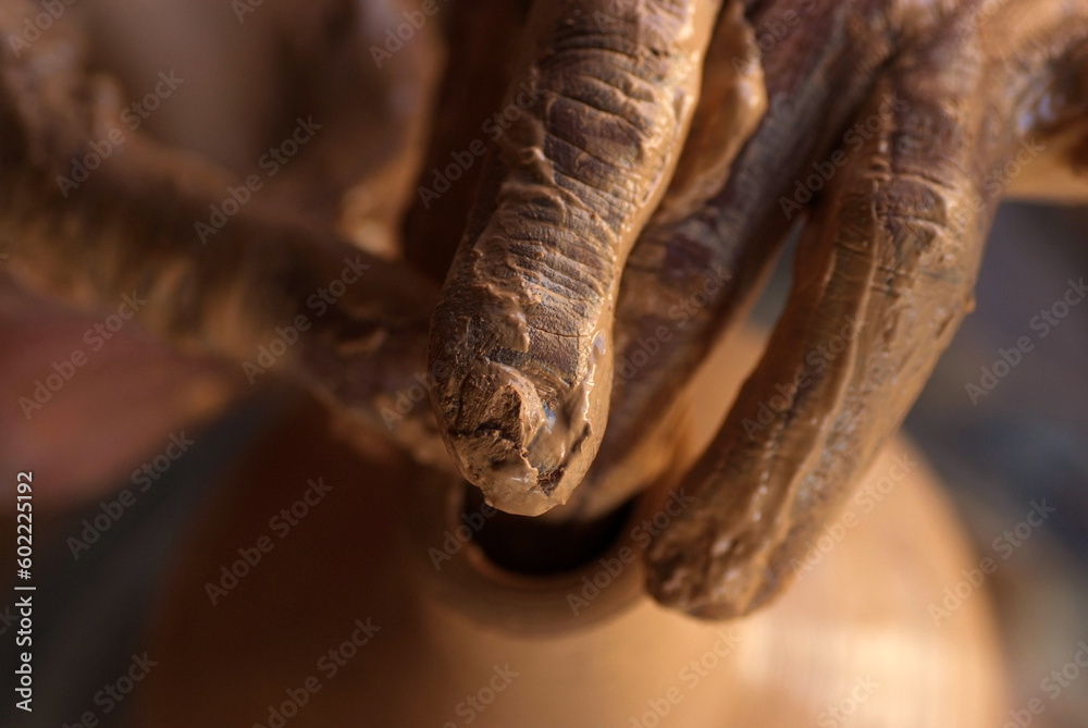 Dirty hands from traces of clay pottery and Close up hands of the traditional pottery making in the old way clay
Dirty hands from traces of clay pottery and Close up hands of the traditional pottery making in the old way clay