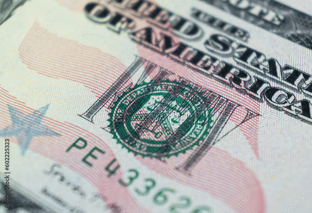 Fototapeta premium Macro shot image of the corner of a 50 dollar bill banknotes. Concept of financial success. Background of 50 dollar bills. Fifty dollars.
