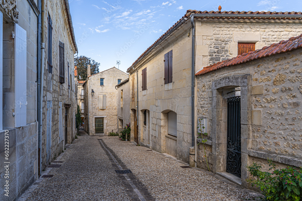 old town street in France with stone houses on both sides