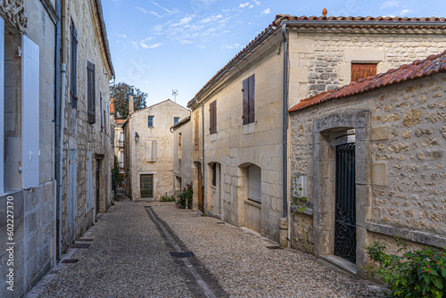 old town street in France with stone houses on both sides © Ieva