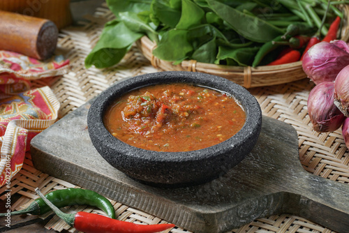 A famous condiment in Malaysia is 'Sambal Belacan' and in Indonesia  is 'Sambal Terasi'