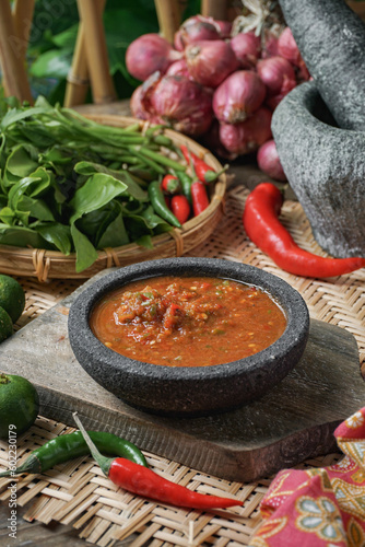 A famous condiment in Malaysia is 'Sambal Belacan' and in Indonesia  is 'Sambal Terasi'