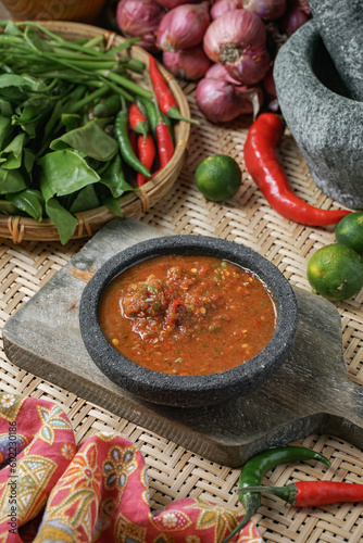 A famous condiment in Malaysia is 'Sambal Belacan' and in Indonesia  is 'Sambal Terasi'