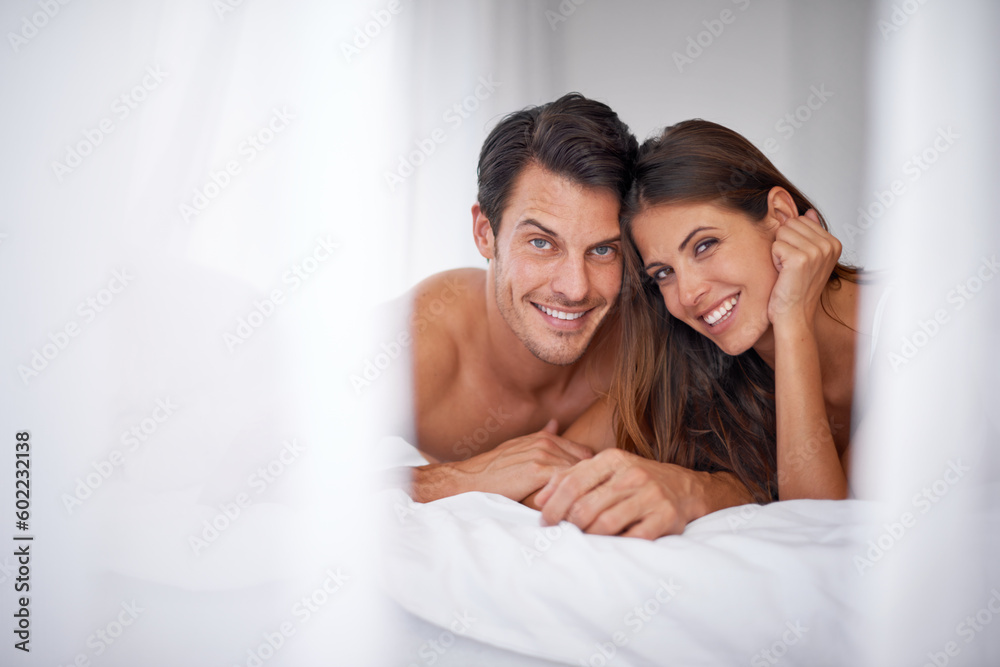 Obraz premium Love, bedroom curtain and portrait couple relax for morning peace, calm and bonding quality time together in Toronto Canada. Happy, mockup and romantic people in hotel bed for Valentines Day holiday