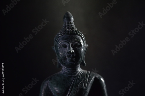 green stone buddha. Hand carved stone Buddha from Thailand. © Utumporn Yawichai