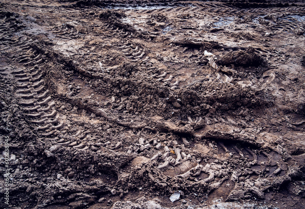 Excavator tire tracks footprint on construction road site Excavator tire tracks footprint on construction road site