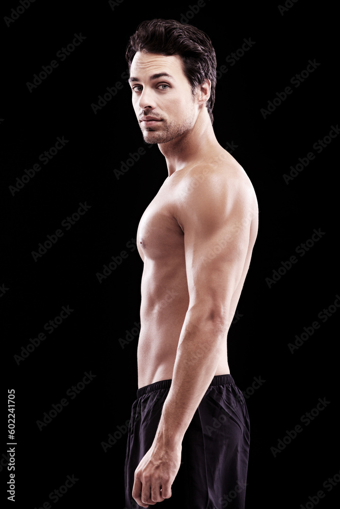 Fototapeta premium Portrait, man and body of bodybuilder on black background, dark studio and muscular abdomen. Sexy, serious and strong male model, sports athlete and fitness power for exercise, training and muscle