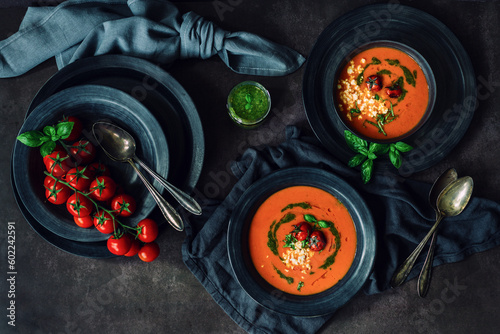 Fresh tomato soup with roasted tomatoes, feta cheese and basil pesto