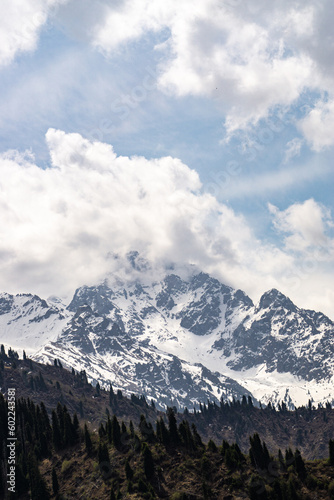 clouds over snowy mountain peaks. cloudy weather in the mountains © Daniil_98_03_09