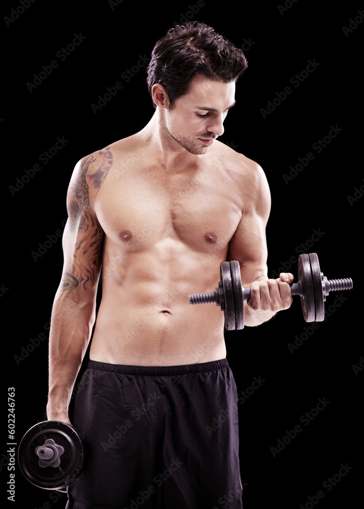 Strong, man and dumbbell exercise on black background, dark studio and gym workout for sexy six pack. Topless bodybuilder, sports athlete and muscle training with weights, fitness power and challenge