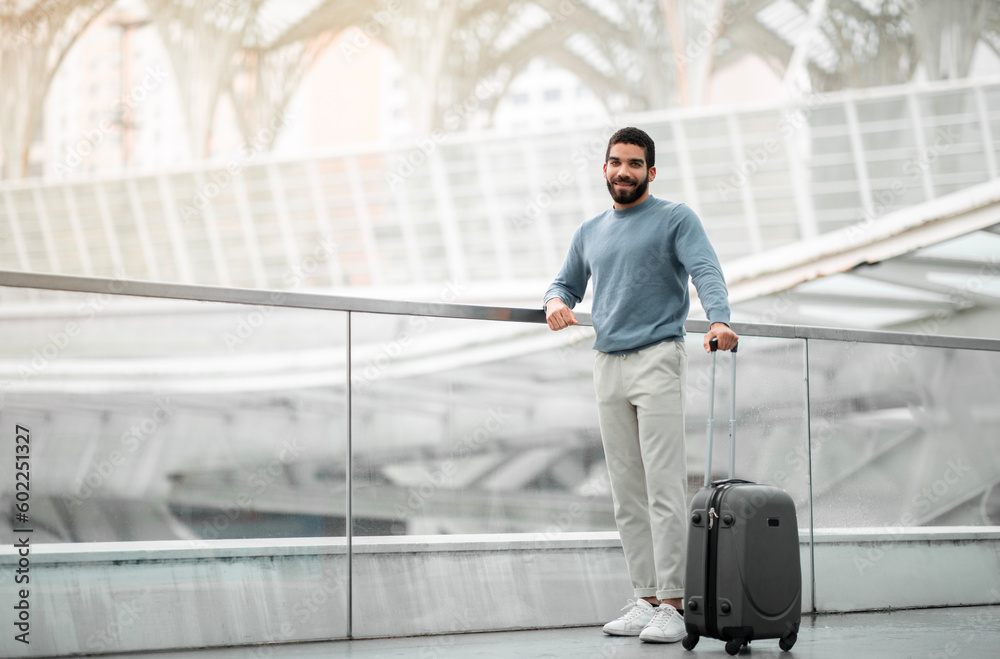 Arabic Tourist Man Posing With Suitcase At Airport, Full Length Arabic Tourist Man Posing With Suitcase At Airport, Full Length