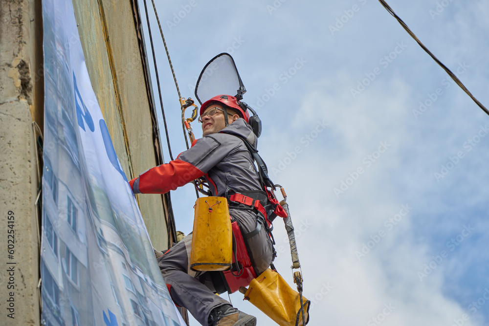 custom made wallpaper toronto digitalRope access is a high-risk job. A man works on ropes.