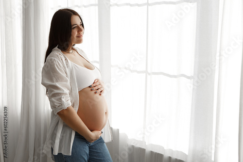 Pregnant woman standing near window in appartment strokes hugging the belly tummy abdomen enjoying pregnancy. Future family, baby infant expecting child inside
Free Download Pregnant woman standing near window in appartment strokes hugging the belly tummy abdomen enjoying pregnancy. Future family, baby infant expecting child inside
- GFXLoad