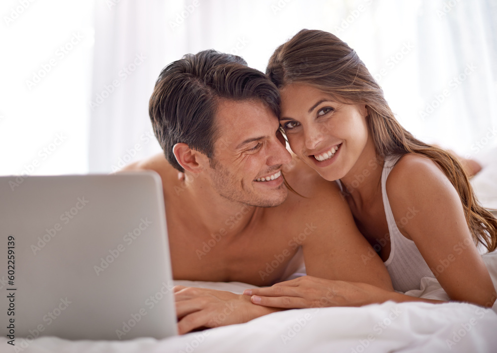 Laptop, love and happy couple lying in bed together while watching a online movie or video at home. Happiness, smile and portrait of a woman browsing the internet on computer with husband in bedroom. Laptop, love and happy couple lying in bed together while watching a online movie or video at home. Happiness, smile and portrait of a woman browsing the internet on computer with husband in bedroom.