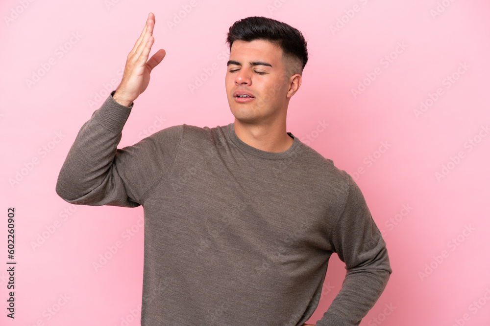 Young caucasian handsome man isolated on pink background with tired and sick expression Young caucasian handsome man isolated on pink background with tired and sick expression