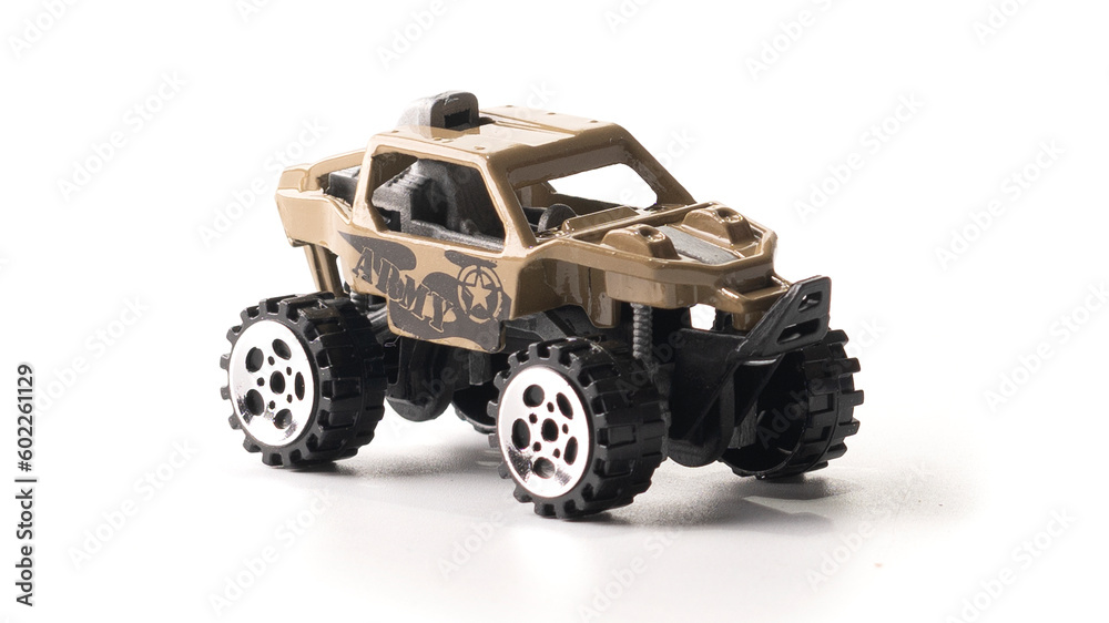 Plastic model of a military SUV toy car isolated on white background.