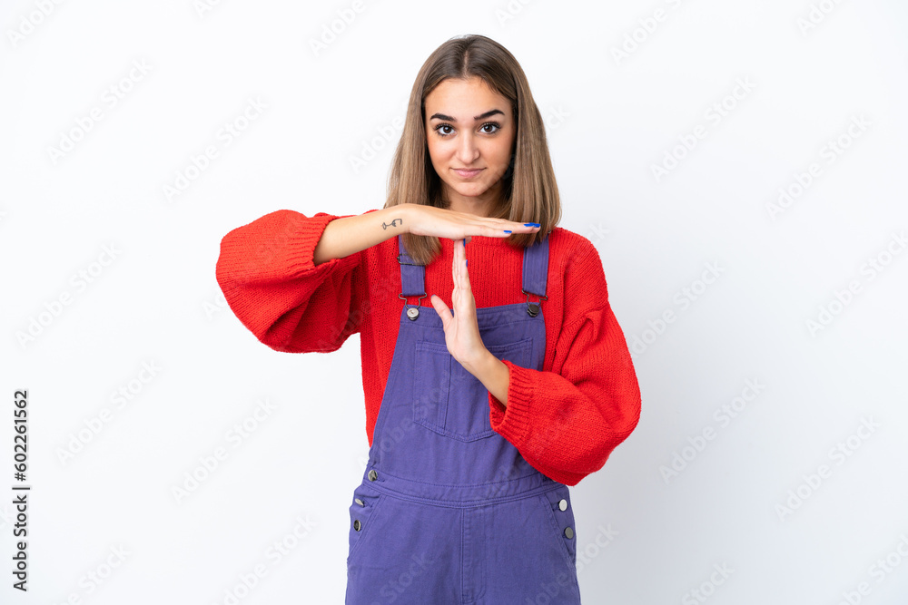 Young caucasian woman isolated on white background making time out gesture Young caucasian woman isolated on white background making time out gesture