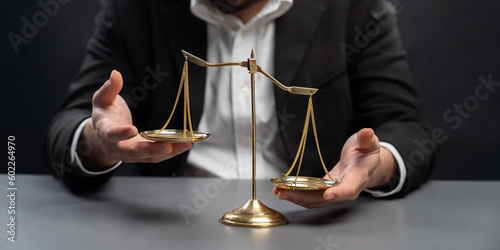 Canvas Print Lawyer or judge in formal black suit hold unbalanced scale with expression of disappointment trying to fix imbalance as anti-injustice concept to fight against corruption of legal system