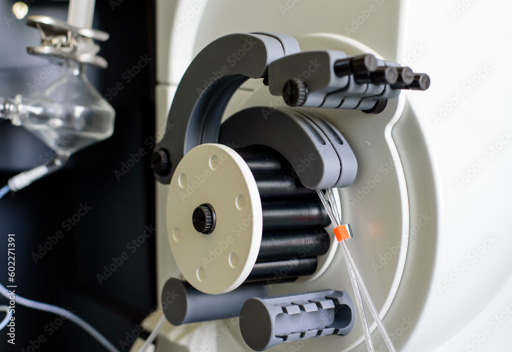 Fototapeta premium Peristaltic pump with plastic tubes and rollers moving.